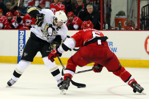 RALEIGH, NC - MAY 23: Sidney Crosby #87 of the Pittsburgh Penguins skates against Tim Gleason #6 of the Carolina Hurricanes during Game Three of the Eastern Conference Championship Round of the 2009 Stanley Cup Playoffs at RBC Center on May 23, 2009 in Raleigh, North Carolina. (Photo by Jim McIsaac/Getty Images)